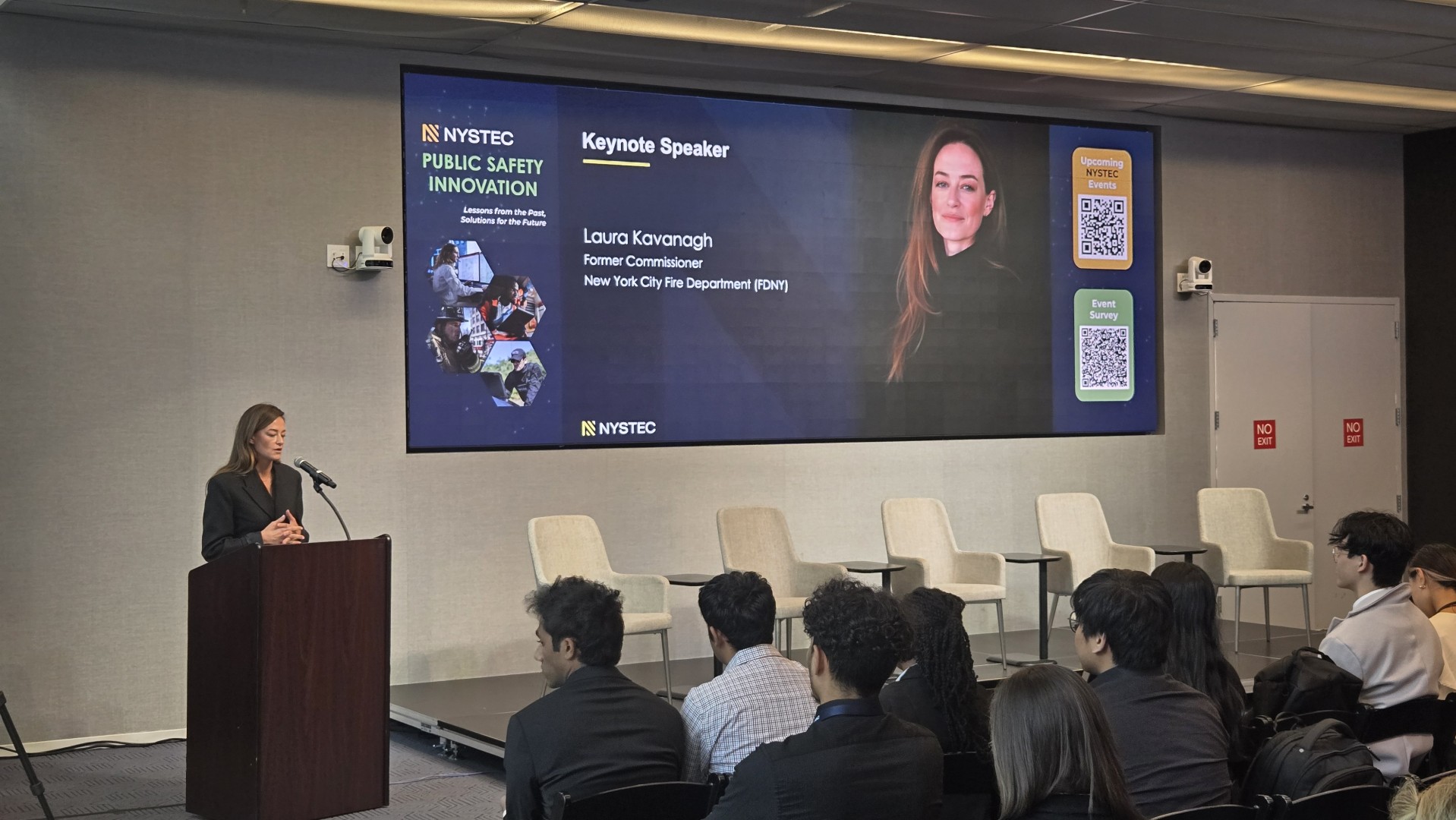 Laura Kavanaugh speaking on stage at the conference