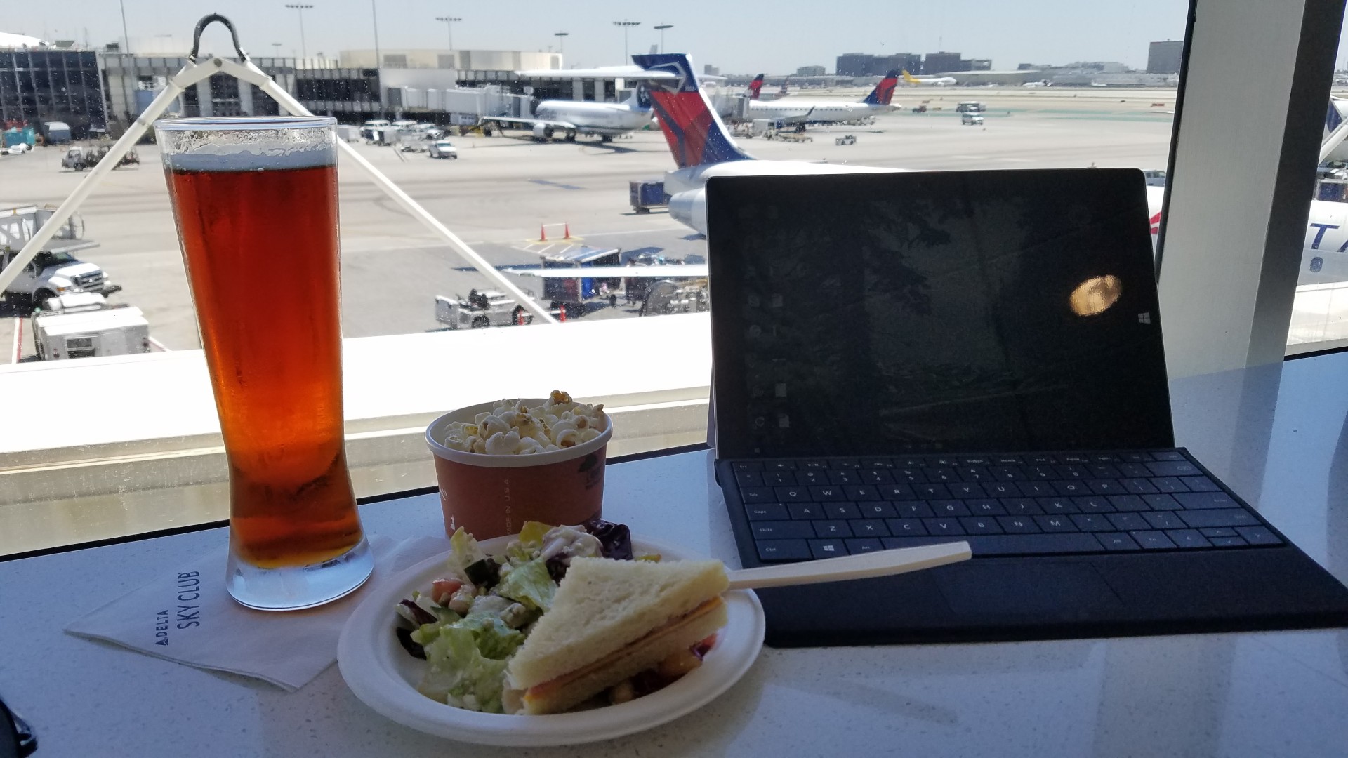 On a layover, in a Delta SkyClub, working on my Surface