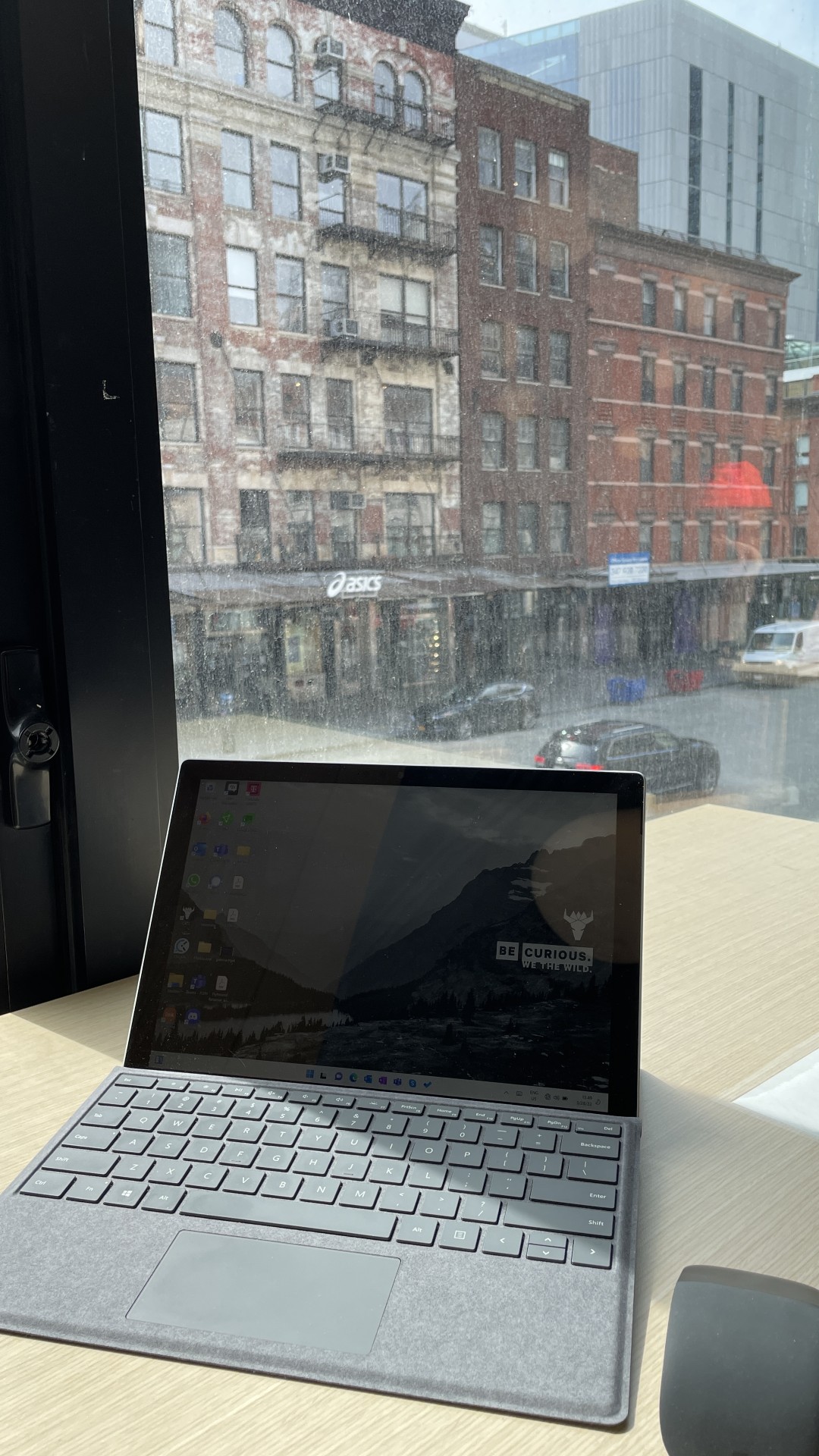 At a coworking desk on E 14th Street in Manhattan getting work done with my Surface